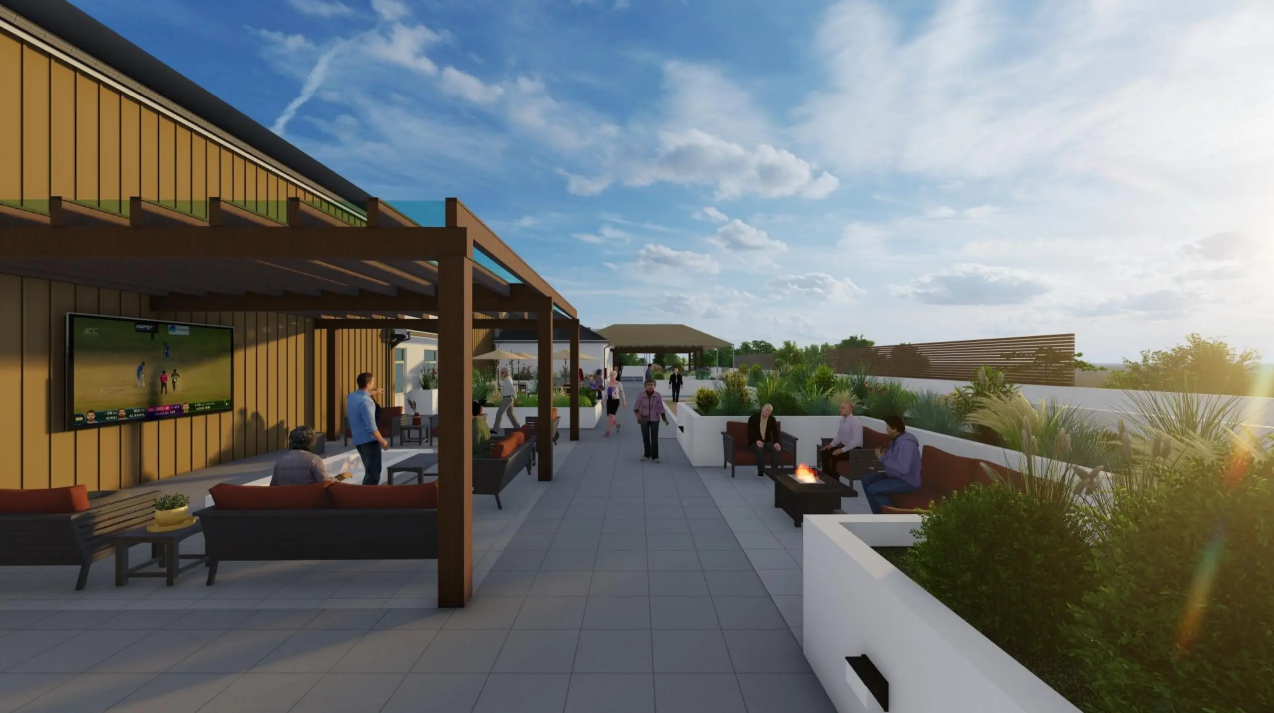 People gather and mingle at couches and tables on a rooftop patio at University Retirement Community